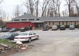 Photo of the Putnam Valley Town Hall with cars parked in front of it