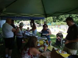 People sitting under a canopy