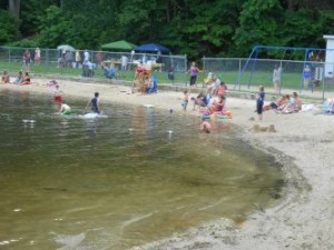 People swimming and on the beach