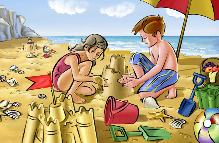 Two children building a sand castle on a beach
